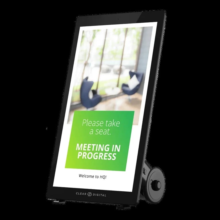 Digital display sign on stand showing meeting room door sign with Please take a seat and Meeting in Progress text